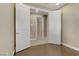 Bedroom with hardwood floors and a double door opening into the hallway at 1189 Hillside Peak St, Henderson, NV 89002