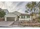 Charming single-story home featuring a well-manicured front yard and inviting facade at 1189 Hillside Peak St, Henderson, NV 89002