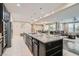 This bright kitchen boasts a large island, stainless steel appliances, and an open layout to the dining and living spaces at 1189 Hillside Peak St, Henderson, NV 89002