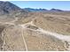Vast desert landscape with distant structure and mountain views at 1189 Hillside Peak St, Henderson, NV 89002