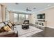 Spacious living room filled with natural light, featuring hardwood floors and comfortable seating at 1189 Hillside Peak St, Henderson, NV 89002
