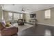 Bright living room with natural light, hardwood floors, and comfortable seating at 1189 Hillside Peak St, Henderson, NV 89002