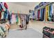 Spacious walk-in closet with built-in shelving and plenty of hanging space for organized storage at 1189 Hillside Peak St, Henderson, NV 89002