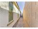 Narrow brick-paved walkway on the side of the house at 1189 Hillside Peak St, Henderson, NV 89002
