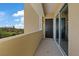 Narrow open-air balcony that leads to a room through sliding glass doors at 120 Los Cabos Dr # 301, Las Vegas, NV 89144