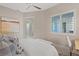 Stylish bedroom with a large window, modern decor, neutral colors, and comfortable furnishings at 120 Los Cabos Dr # 301, Las Vegas, NV 89144