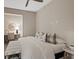Serene bedroom featuring a comfortable bed with stylish pillows and a decorative wall hanging above a desk area at 120 Los Cabos Dr # 301, Las Vegas, NV 89144
