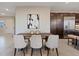 A dining room features a modern table, stylish seating, and neutral decor for an elegant dining space at 120 Los Cabos Dr # 301, Las Vegas, NV 89144