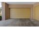 Spacious two-car garage with concrete floor and ample room for storage, indoors at 120 Los Cabos Dr # 301, Las Vegas, NV 89144