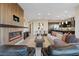 Open-concept living room showcasing a modern fireplace, comfortable seating, and views into the kitchen at 120 Los Cabos Dr # 301, Las Vegas, NV 89144