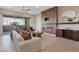 An inviting living room features a fireplace, modern furniture, and access to a private patio at 120 Los Cabos Dr # 301, Las Vegas, NV 89144