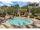 Inviting spa pool area features lush landscaping and lounge chairs for relaxation at 120 Los Cabos Dr # 301, Las Vegas, NV 89144
