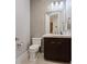 Elegant powder room featuring stylish tile, modern fixtures, and a decorative mirror, perfect for guests at 120 Los Cabos Dr # 301, Las Vegas, NV 89144