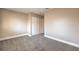 Well-lit bedroom featuring neutral walls and carpet at 1800 Edmond St # 124, Las Vegas, NV 89146