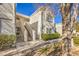 Exterior view of condo building with stairs and landscaping at 1800 Edmond St # 124, Las Vegas, NV 89146
