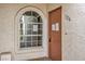 Condo unit's front door and arched window at 1800 Edmond St # 124, Las Vegas, NV 89146