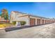 Exterior view of building with multiple garages at 1800 Edmond St # 124, Las Vegas, NV 89146