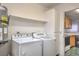 Laundry room with washer, dryer, and extra shelving at 1800 Edmond St # 124, Las Vegas, NV 89146