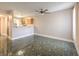 Living room with tile floor and kitchen access at 1800 Edmond St # 124, Las Vegas, NV 89146