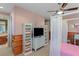 Bright bedroom with TV and storage, adjacent to bathroom at 1975 Alcova Ridge Dr, Las Vegas, NV 89135