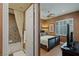 Guest bedroom with ensuite bathroom and a flat-screen TV at 1975 Alcova Ridge Dr, Las Vegas, NV 89135
