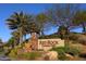 Red Rock Country Club entrance with landscaping and signage at 1975 Alcova Ridge Dr, Las Vegas, NV 89135