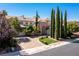 Elegant two-story home with manicured landscaping and a spacious driveway at 1975 Alcova Ridge Dr, Las Vegas, NV 89135