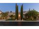 Beautiful two-story home with landscaping and tall trees at 1975 Alcova Ridge Dr, Las Vegas, NV 89135