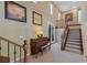 Spacious landing with a piano and access to upper level at 1975 Alcova Ridge Dr, Las Vegas, NV 89135