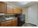 Convenient laundry room with washer, dryer, and cabinets at 1975 Alcova Ridge Dr, Las Vegas, NV 89135