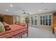 Main bedroom with a fireplace, king bed, and access to balcony at 1975 Alcova Ridge Dr, Las Vegas, NV 89135