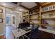 Spacious home office with granite countertop and built-in shelving at 1975 Alcova Ridge Dr, Las Vegas, NV 89135