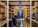 Home office with built-in shelves and a large work surface at 1975 Alcova Ridge Dr, Las Vegas, NV 89135