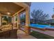 Relaxing covered patio overlooking a sparkling pool, perfect for entertaining at 1975 Alcova Ridge Dr, Las Vegas, NV 89135