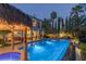 Inviting pool and spa area with a tiki bar and plenty of lounge space at 1975 Alcova Ridge Dr, Las Vegas, NV 89135