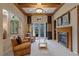 Cozy sitting area with a fireplace and access to the backyard at 1975 Alcova Ridge Dr, Las Vegas, NV 89135