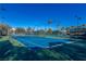 Two well-maintained tennis courts with surrounding landscape at 1975 Alcova Ridge Dr, Las Vegas, NV 89135