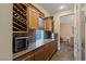 Wet bar with wine storage and microwave at 1975 Alcova Ridge Dr, Las Vegas, NV 89135