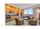 Kitchenette with wood cabinets, stainless steel appliances, and city view at 2000 N Fashion Show Dr # 3709, Las Vegas, NV 89109
