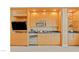 Compact kitchenette with wood cabinets and stainless steel appliances at 2000 N Fashion Show Dr # 3709, Las Vegas, NV 89109