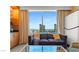 Living room with city view, sofa, and coffee table at 2000 N Fashion Show Dr # 3709, Las Vegas, NV 89109
