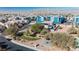 Bird's-eye view of a neighborhood park surrounded by homes and blue apartments, highlighting community amenities at 2905 Vigilante Ct, North Las Vegas, NV 89081