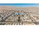 Wide aerial shot displays an organized community development beneath a clear sky and distant mountain range at 2905 Vigilante Ct, North Las Vegas, NV 89081