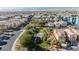 Panoramic community view with a central park, blue apartment buildings and residential homes at 2905 Vigilante Ct, North Las Vegas, NV 89081