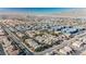 Aerial perspective of a suburban neighborhood with blue apartment buildings and consistent residential architecture at 2905 Vigilante Ct, North Las Vegas, NV 89081