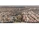 Expansive aerial view of a well-planned community with tree-lined streets and meticulously maintained homes at 2905 Vigilante Ct, North Las Vegas, NV 89081