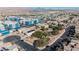 Overhead shot of neighborhood with blue buildings and a community park, capturing the blend of urban and green spaces at 2905 Vigilante Ct, North Las Vegas, NV 89081
