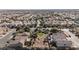 Expansive aerial view of a densely populated neighborhood with a green community park in the foreground at 2905 Vigilante Ct, North Las Vegas, NV 89081