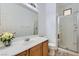 Bathroom with a single sink vanity, tile flooring, glass enclosed walk in shower, and white paint at 2905 Vigilante Ct, North Las Vegas, NV 89081