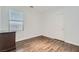 Cozy bedroom with a window and laminate wood flooring, providing a simple, comfortable space at 2905 Vigilante Ct, North Las Vegas, NV 89081